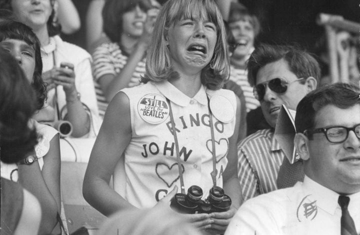 One of the Beatles fangirls crying at a concert